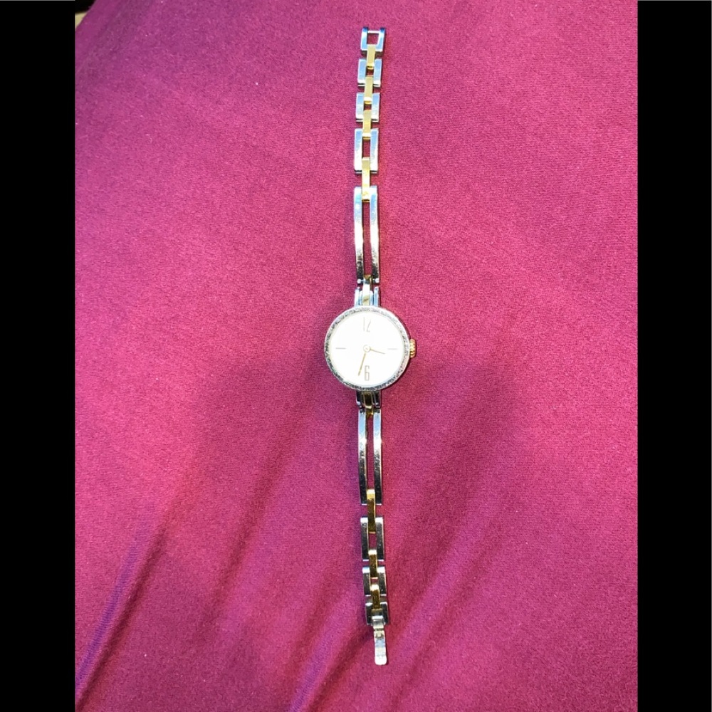 Used silver and gold Coach watch. Slim design